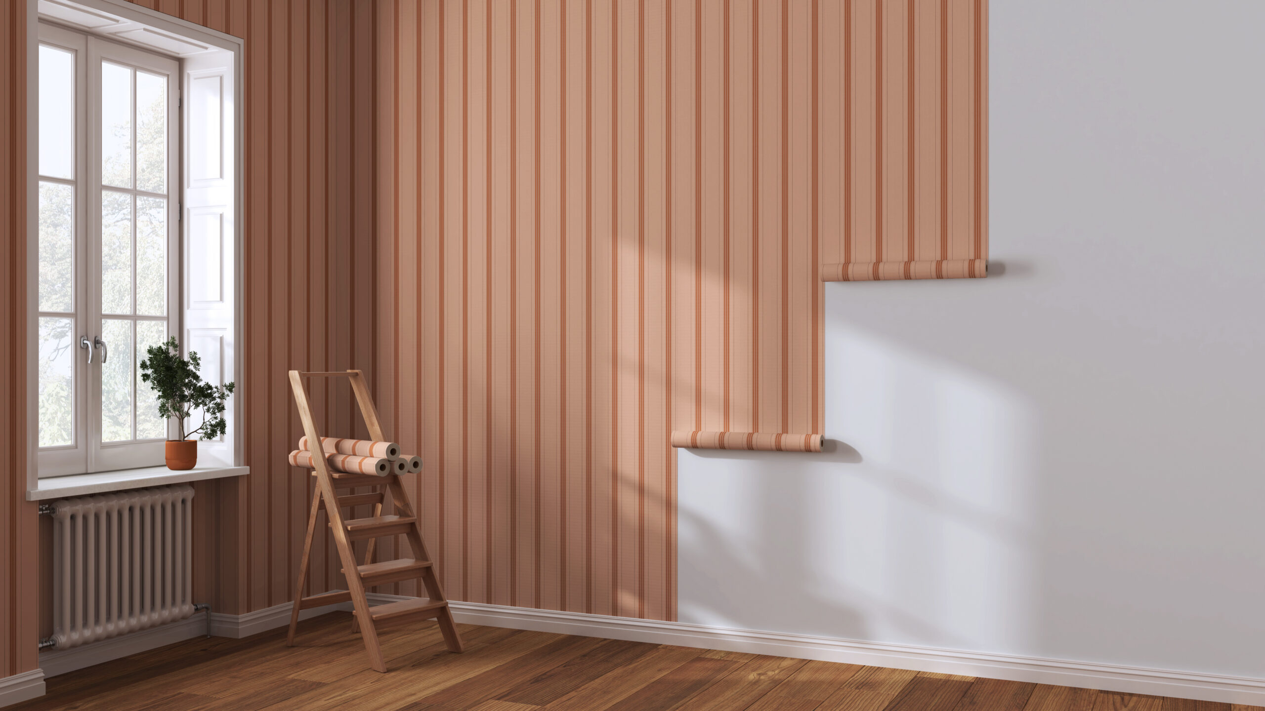 Empty room with white walls and parquet floor, shits of striped orange wallpaper on the wall with copy space. Housework concept